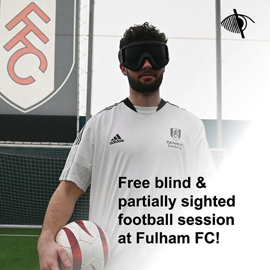 Image shows a man with dark curly hair and beard wearing a dark visor over his eyes, wearing a Fulham FC football shirt and holding a football. Behind him is a football pitch and a Fulham FC flag. Text in black says 'Free blind & partially sighted football session at Fulham FC!'.
